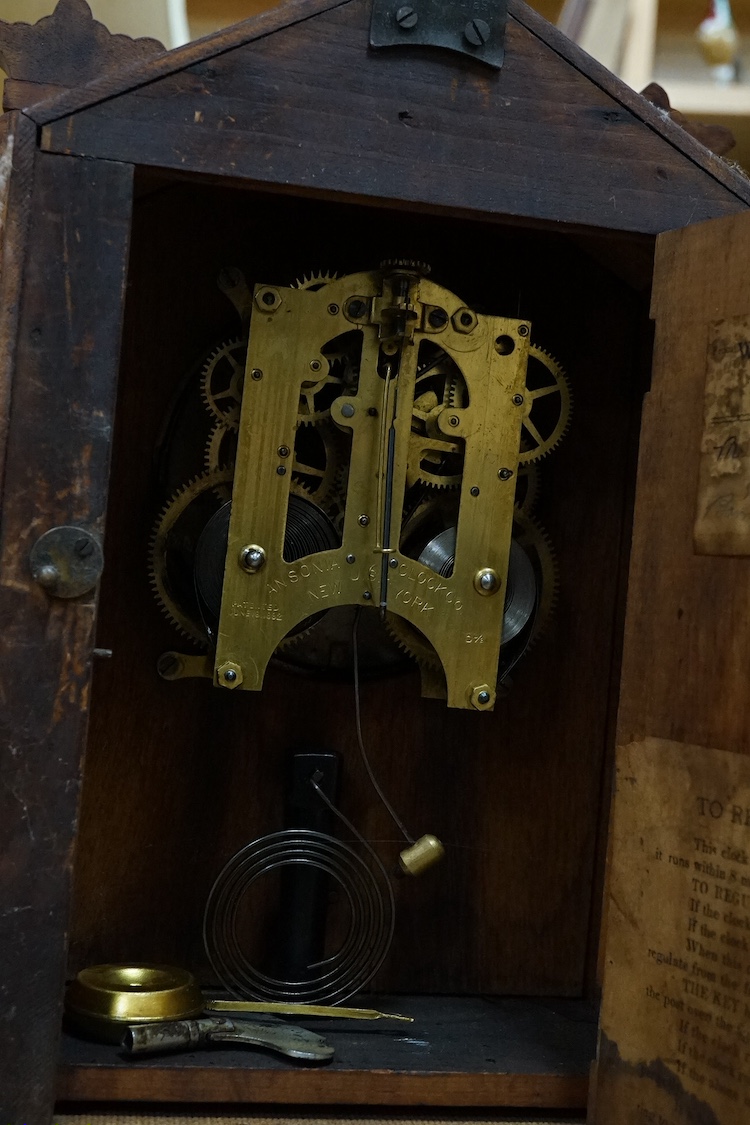 An American mahogany mantel clock with Roman numeral dial, 38cm high. Condition - good, untested